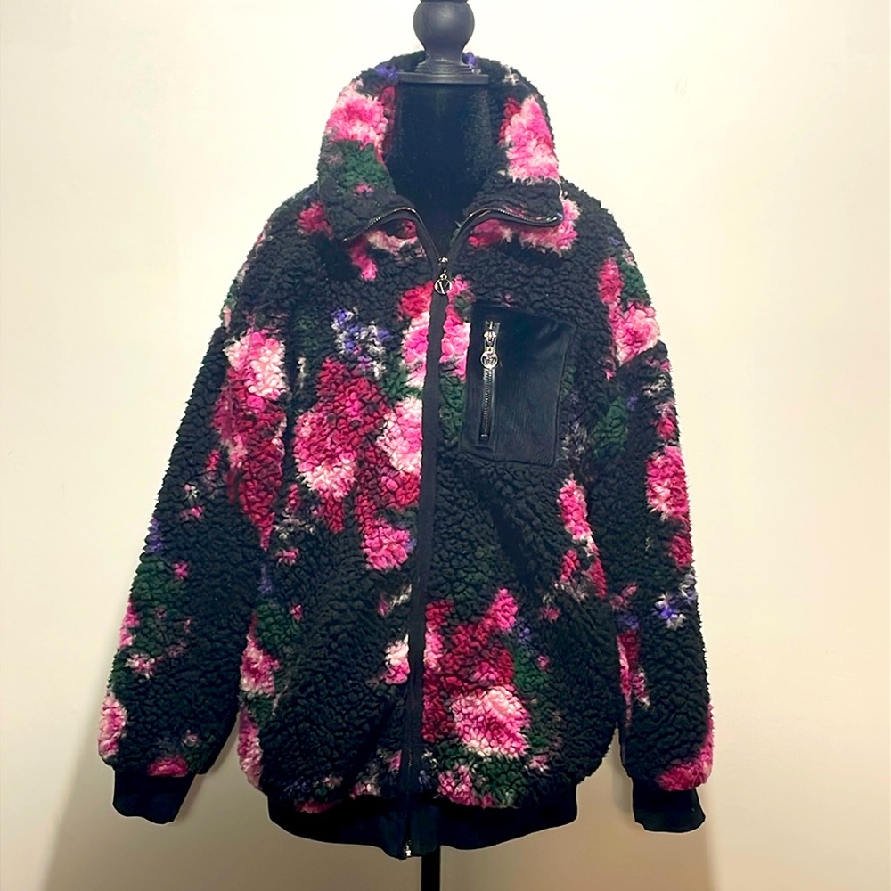 Victoria secret fleece jacket women’s small fits like a medium to large.